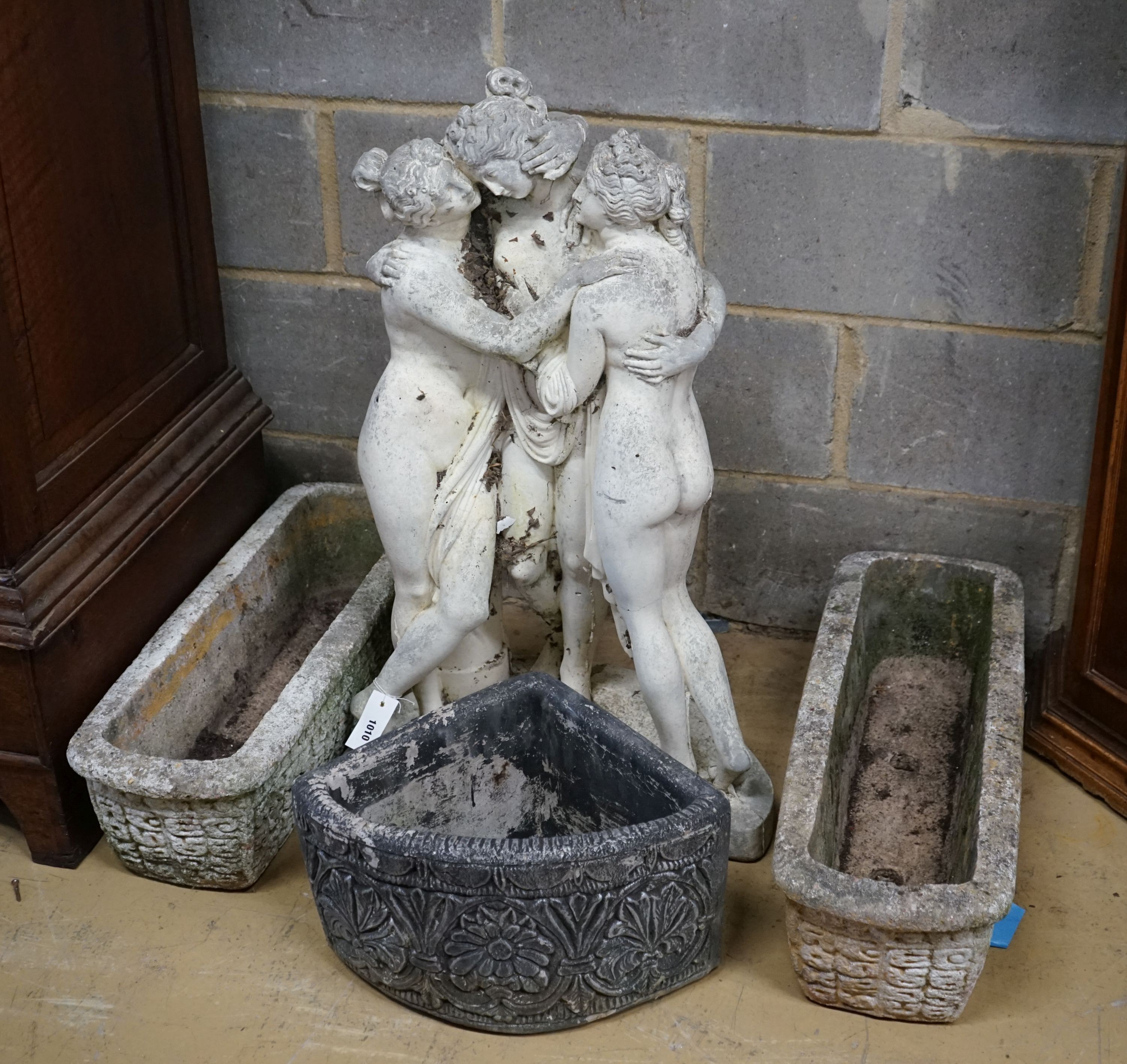 A reconstituted stone garden ornament, the Three Graces, height 84cm together with three planters